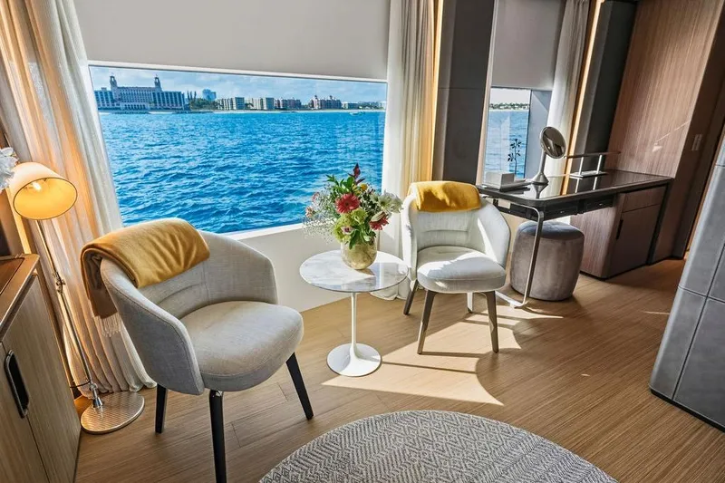 Randy Beth Yacht Photos Pics Luxurious yacht interior with ocean view, featuring elegant seating and decor, Custom Line 120, 2018.