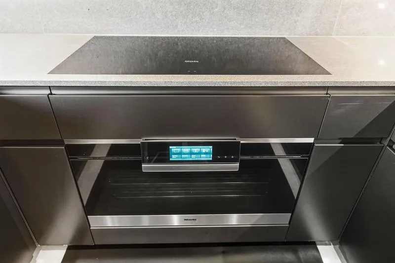 Randy Beth Yacht Photos Pics Modern kitchen with Custom Line 120 oven, sleek design, touch controls, 2018 model.