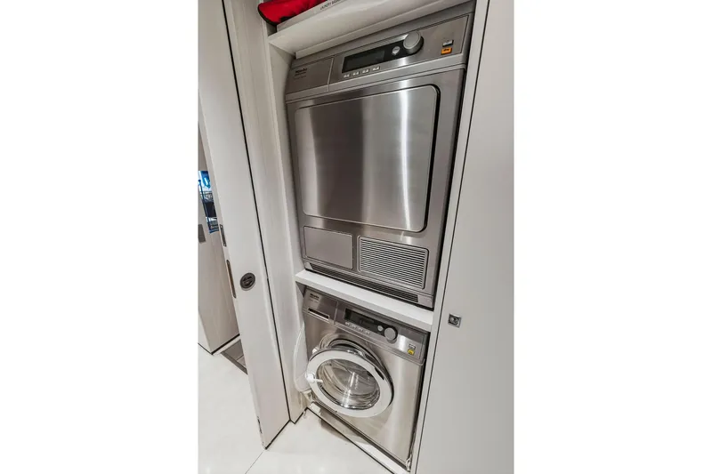 Randy Beth Yacht Photos Pics Stacked washer and dryer in a compact laundry space, Custom Line 120, 2018 model.