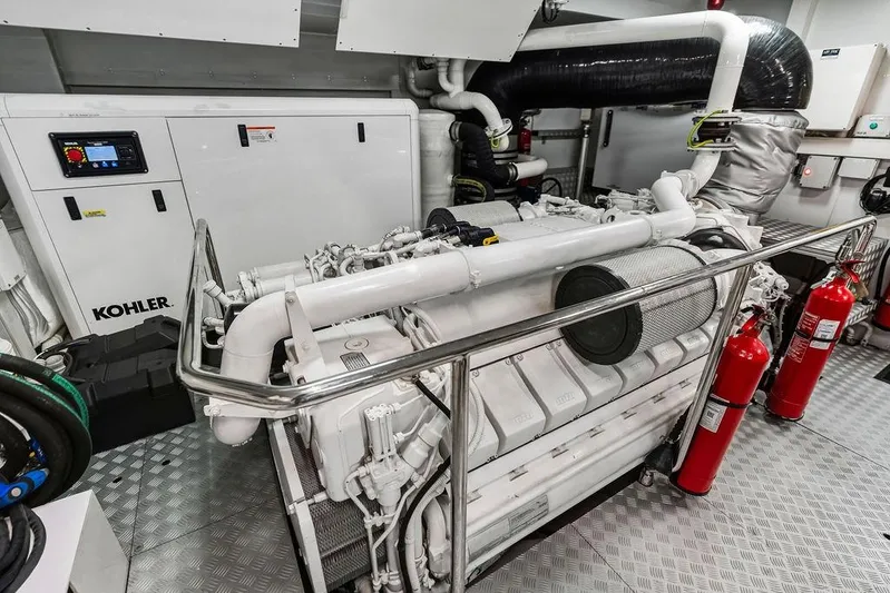 Randy Beth Yacht Photos Pics Engine room of a 2018 Custom Line 120 yacht with Kohler generator and fire extinguishers.