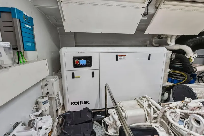 Randy Beth Yacht Photos Pics Engine room of Custom Line 120 yacht, featuring Kohler generator, 2018 model.