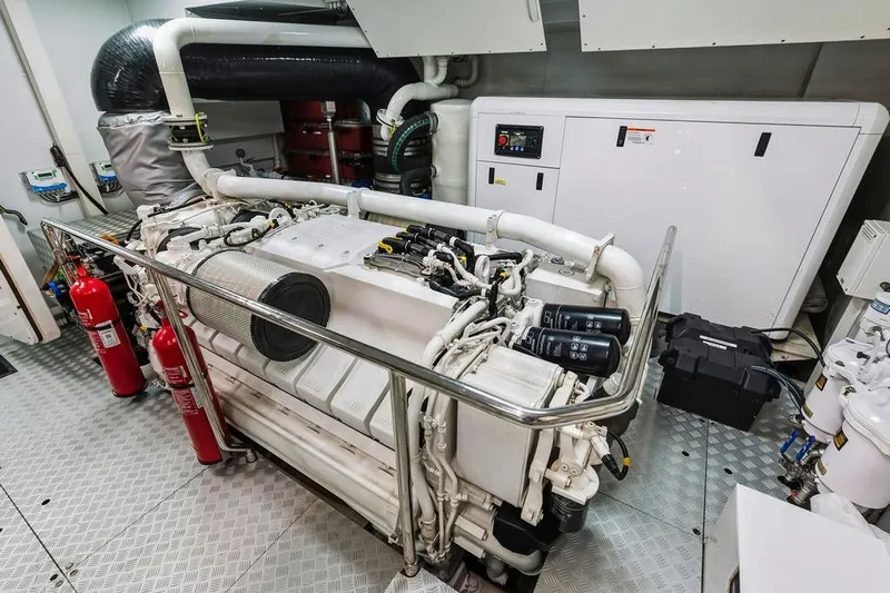 Randy Beth Yacht Photos Pics Engine room of 2018 Custom Line 120 yacht with fire extinguishers and control panel.