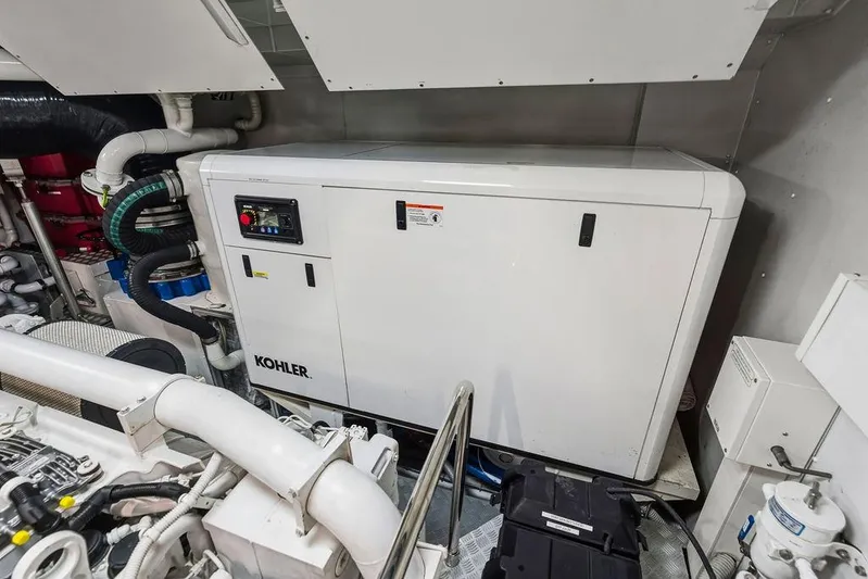 Randy Beth Yacht Photos Pics Engine room with Kohler generator in a 2018 Custom Line 120 yacht.