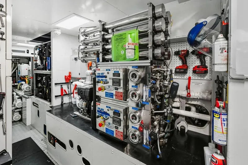 Randy Beth Yacht Photos Pics Interior of a 2018 Custom Line 120 yacht engine room with advanced machinery and tools.