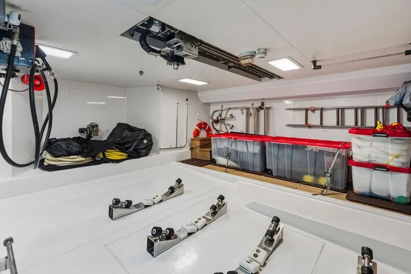 Randy Beth Yacht Photos Pics Spacious 2018 Custom Line 120 yacht storage area with organized equipment and containers.