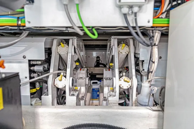 Randy Beth Yacht Photos Pics Engine compartment of a 2018 Custom Line 120 yacht, showcasing mechanical components and wiring.