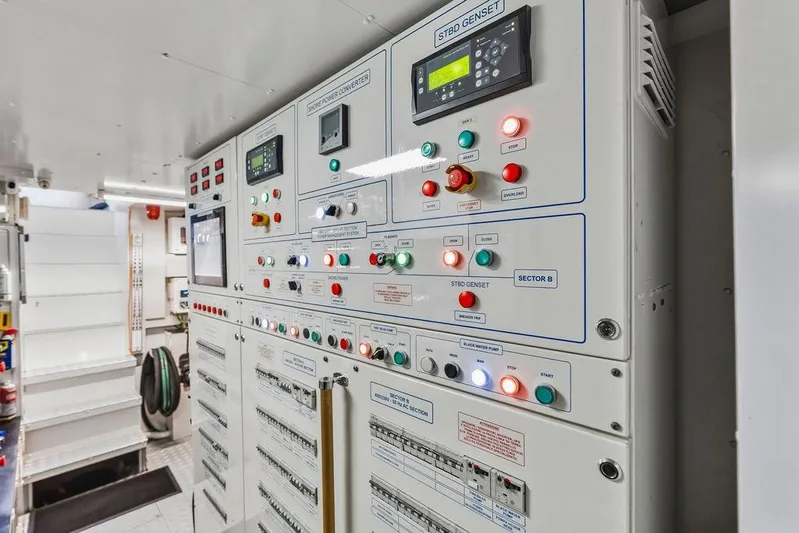 Randy Beth Yacht Photos Pics Control panel in a 2018 Custom Line 120 yacht, featuring various switches and indicators.