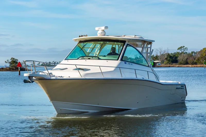  Yacht Photos Pics 2020 Grady-White 370 Express boat cruising on a calm waterway.