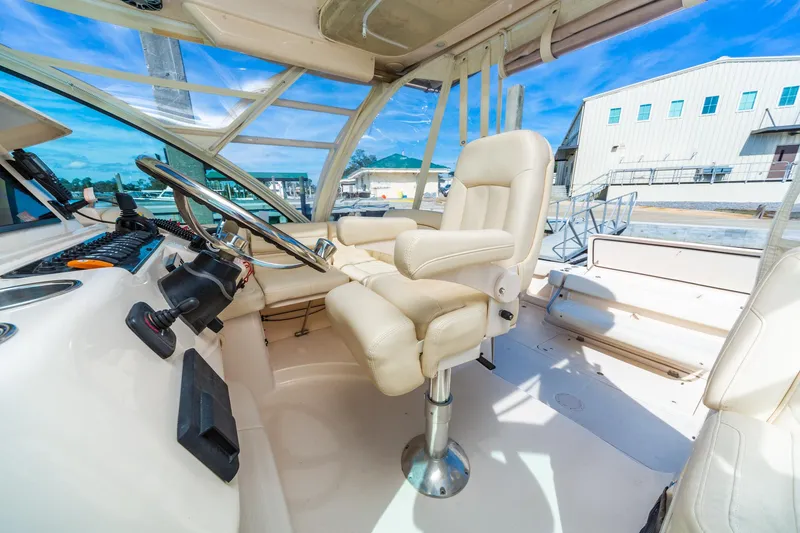  Yacht Photos Pics 2020 Grady-White 370 Express boat interior with helm and seating area.