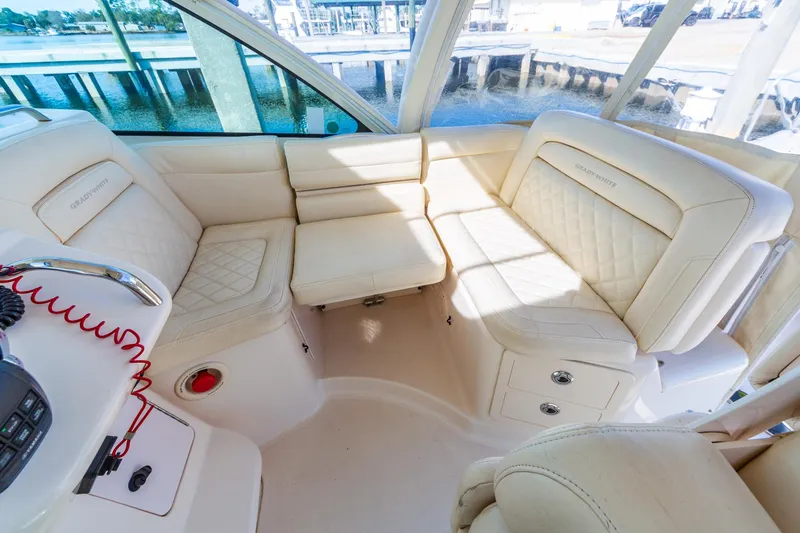  Yacht Photos Pics 2020 Grady-White 370 Express boat interior with luxurious white seating.