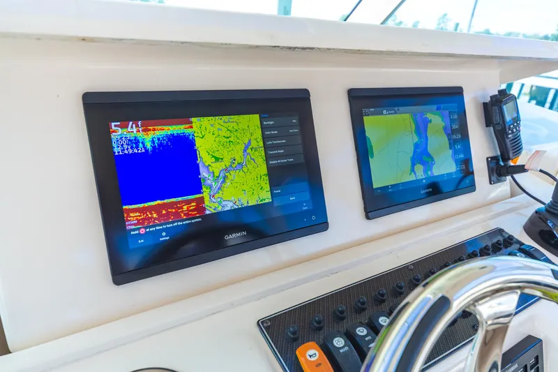  Yacht Photos Pics Garmin navigation screens on 2020 Grady-White 370 Express boat dashboard.