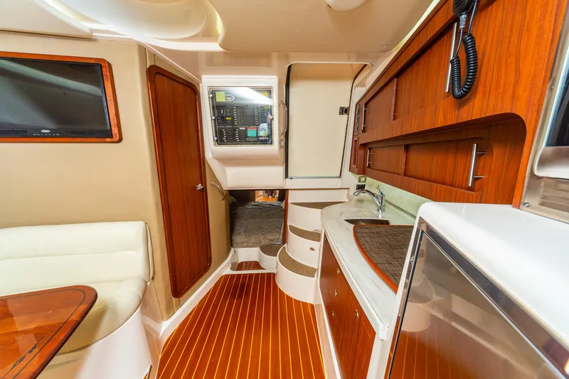  Yacht Photos Pics Interior of 2020 Grady-White 370 Express boat with wood accents and modern amenities.