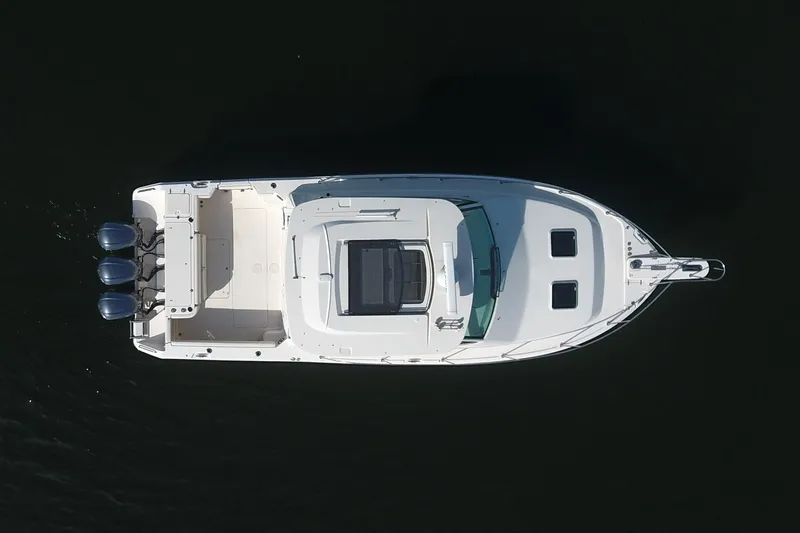  Yacht Photos Pics Aerial view of 2020 Grady-White 370 Express boat on dark water.