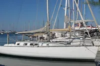 Sailboats docked at a marina, featuring a DanielP1Tester One-Off Design from 2012.