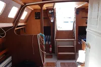 Cozy wooden boat interior with steps, windows, and nautical equipment, DanielP1Tester One-Off Design, 2012.