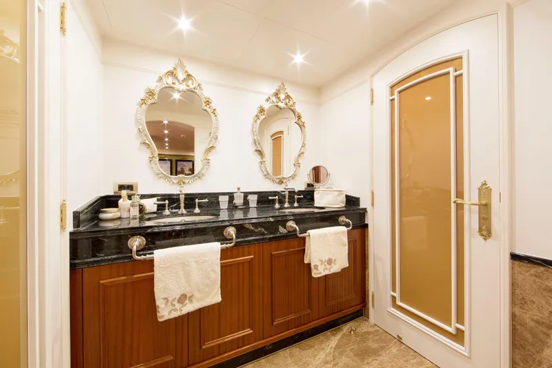  Yacht Photos Pics Luxurious bathroom in Van der Valk Explorer 37M yacht, featuring double sinks and ornate mirrors.
