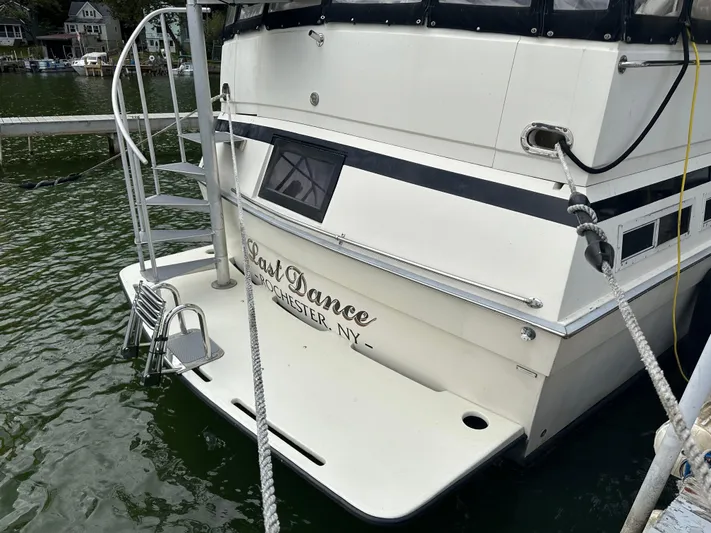 Last Dance Yacht Photos Pics 1987 Viking Boats 44 Motor Yacht docked, rear view with Last Dance name.