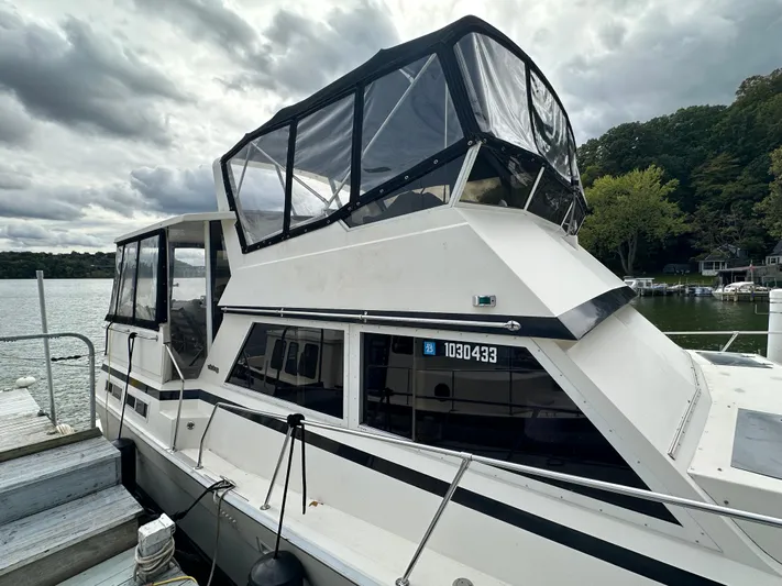 Last Dance Yacht Photos Pics 1987 Viking Boats 44 Motor Yacht docked on a cloudy day.