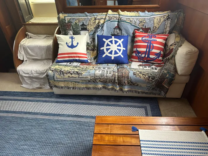 Last Dance Yacht Photos Pics Nautical-themed interior of a 1987 Viking Boats 44 Motor Yacht with decorative pillows.