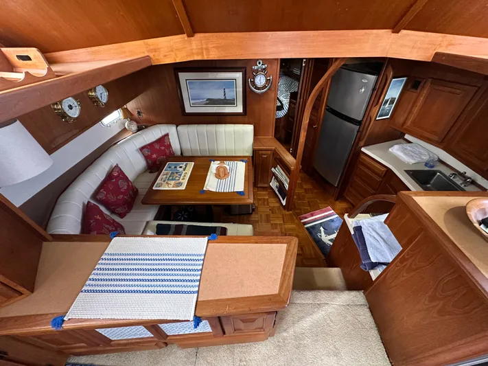 Last Dance Yacht Photos Pics Interior of 1987 Viking Boats 44 Motor Yacht with dining area and kitchen.