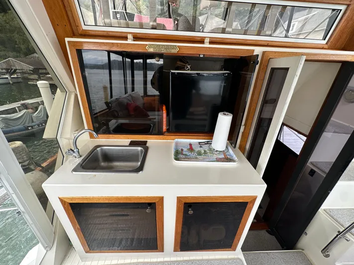 Last Dance Yacht Photos Pics 1987 Viking Boats 44 Motor Yacht kitchen area with sink and storage cabinets.