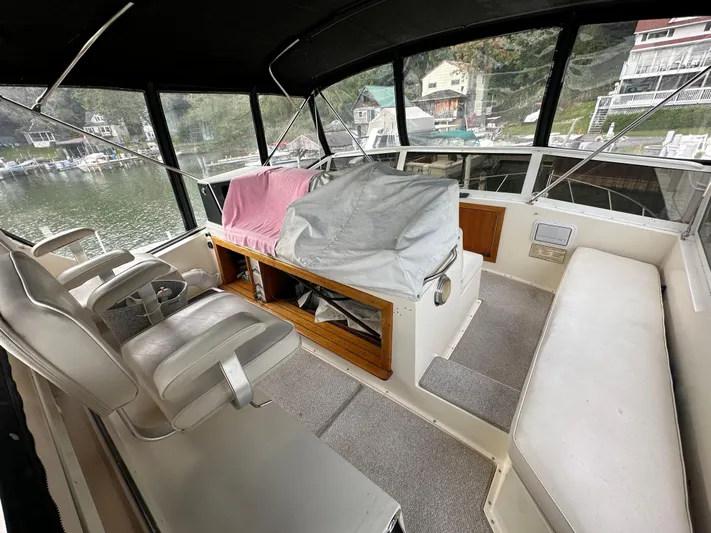 Last Dance Yacht Photos Pics 1987 Viking Boats 44 Motor Yacht interior with helm, seating, and covered console.