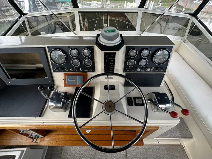 Last Dance Yacht Photos Pics 1987 Viking Boats 44 Motor Yacht helm with steering wheel and control panel.