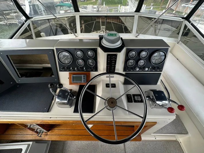 Last Dance Yacht Photos Pics 1987 Viking Boats 44 Motor Yacht helm with steering wheel and control panel.