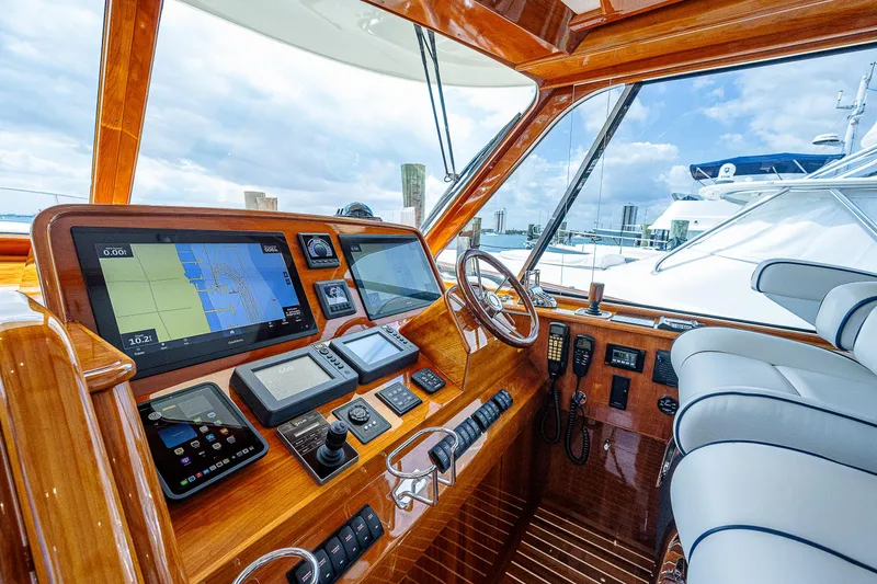 Mel Belle Yacht Photos Pics 2018 Hinckley Talaria 55 MKII MY yacht cockpit with navigation equipment and luxurious seating.