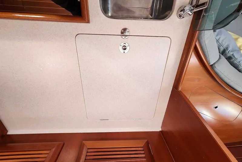 Rick B Yacht Photos Pics Interior view of a 2006 Beneteau 473 yacht, featuring a wooden panel and sink.