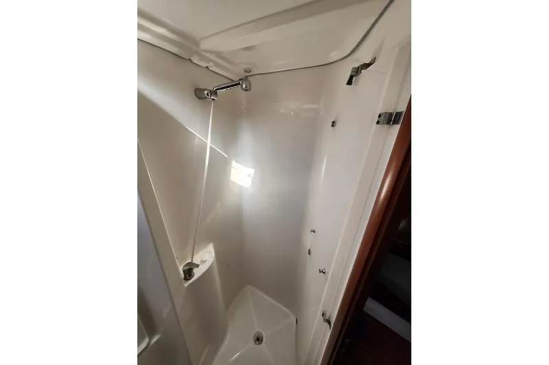 Rick B Yacht Photos Pics Shower area in 2006 Beneteau 473 yacht, featuring sleek white interior design.
