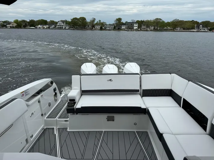  Yacht Photos Pics 2021 Monterey 385 Super Express boat interior with white seating on a lake.
