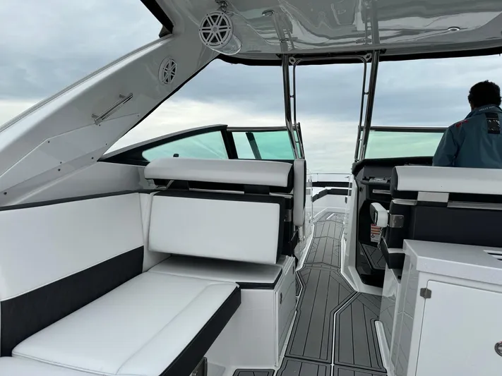  Yacht Photos Pics 2021 Monterey 385 Super Express boat interior with white seating and modern design.