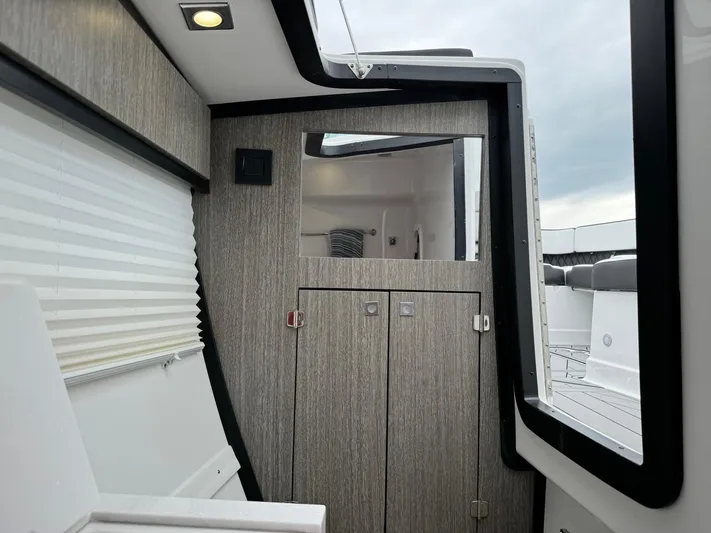  Yacht Photos Pics 2021 Monterey 385 Super Express cabin interior with modern wood finish.