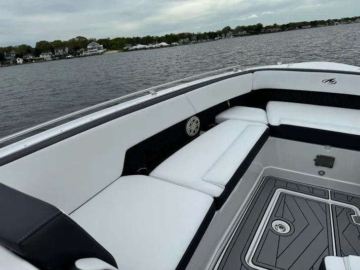  Yacht Photos Pics 2021 Monterey 385 Super Express boat interior with white seating, on a calm lake.