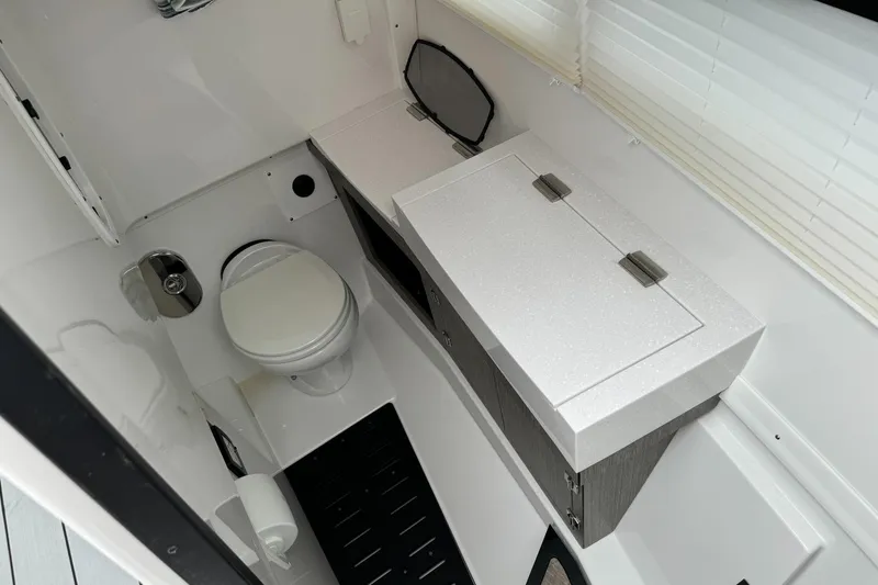  Yacht Photos Pics 2021 Monterey 385 Super Express boat bathroom with toilet and vanity.