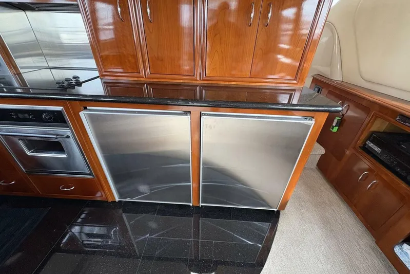 Carlet Vivian IV Yacht Photos Pics Luxurious kitchen area in 2004 Carver 56 Voyager yacht with stainless steel appliances.