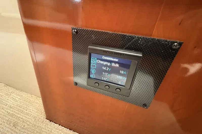 Carlet Vivian IV Yacht Photos Pics Mastervolt control panel on 2004 Carver 56 Voyager yacht, displaying charging status.