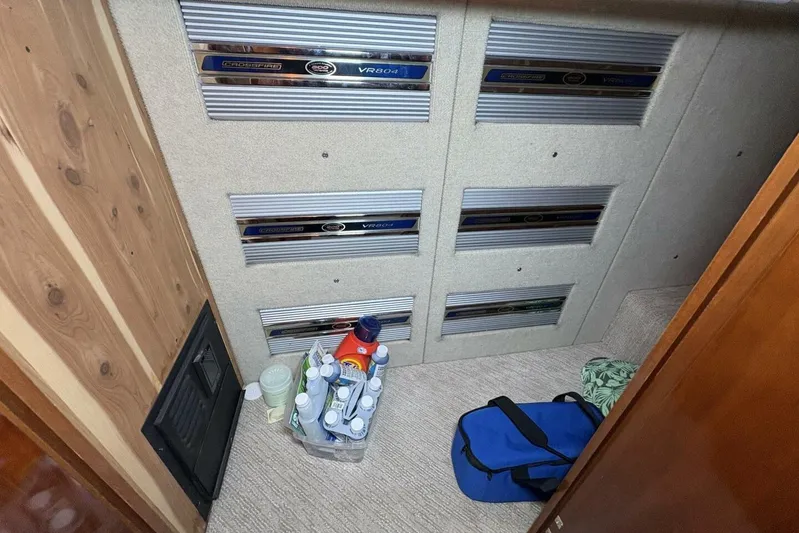 Carlet Vivian IV Yacht Photos Pics 2004 Carver 56 Voyager interior with storage, amplifiers, and cleaning supplies.