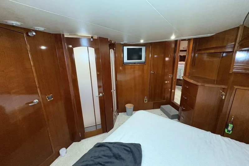 Carlet Vivian IV Yacht Photos Pics Luxurious 2004 Carver 56 Voyager yacht interior with wood paneling and modern amenities.