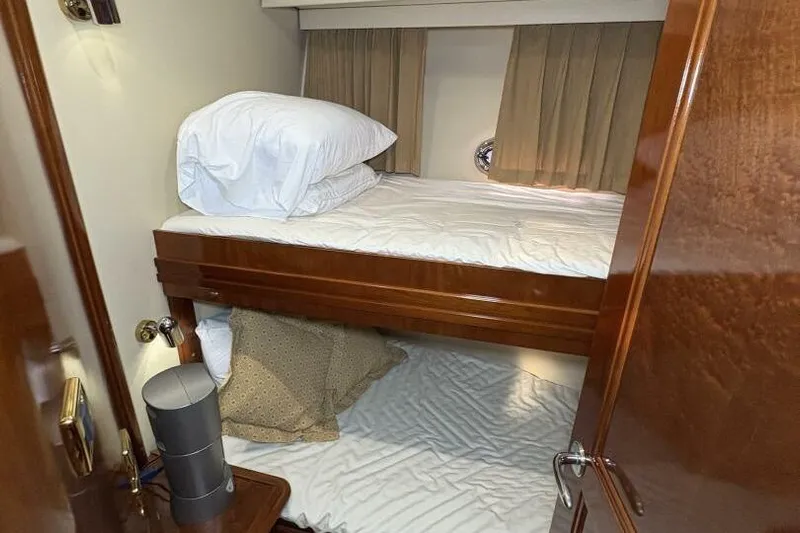 Carlet Vivian IV Yacht Photos Pics 2004 Carver 56 Voyager cabin with bunk beds and wooden interior.