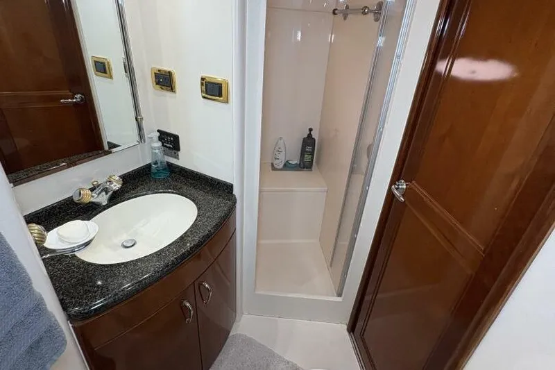 Carlet Vivian IV Yacht Photos Pics Luxurious bathroom in 2004 Carver 56 Voyager yacht with granite countertop and shower.