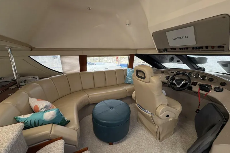 Carlet Vivian IV Yacht Photos Pics Luxurious interior of 2004 Carver 56 Voyager yacht with leather seating and Garmin navigation.