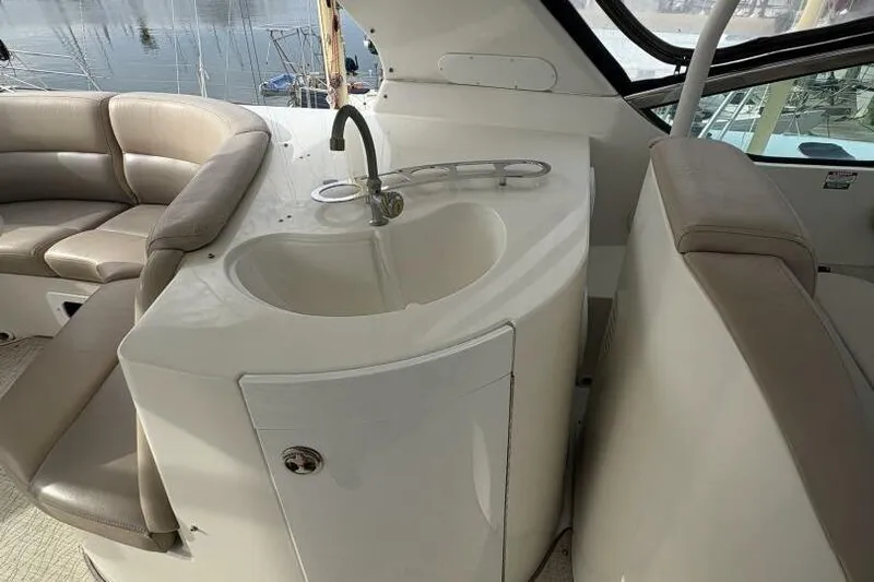 Carlet Vivian IV Yacht Photos Pics 2004 Carver 56 Voyager yacht interior with sink and seating area.