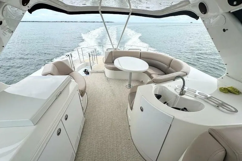 Carlet Vivian IV Yacht Photos Pics Luxurious 2004 Carver 56 Voyager yacht interior with seating and ocean view.