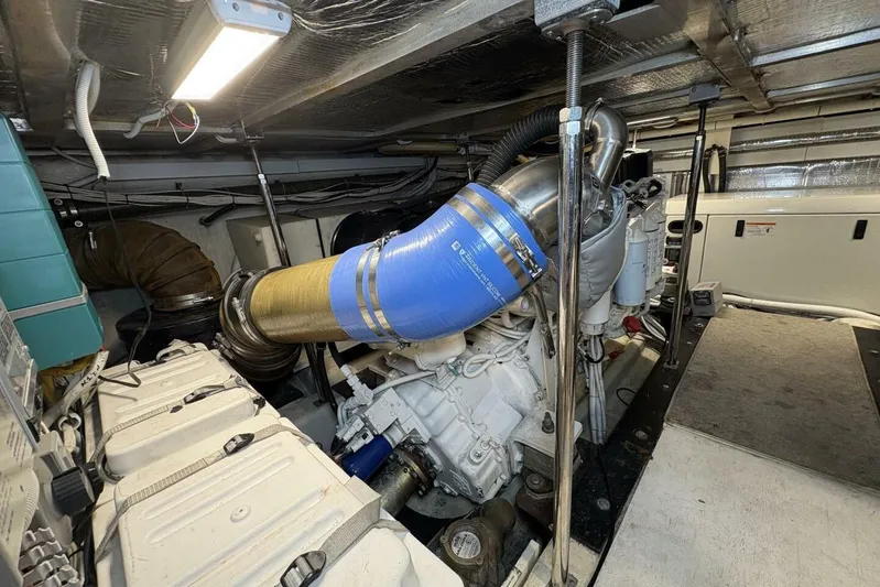 Carlet Vivian IV Yacht Photos Pics Engine room of a 2004 Carver 56 Voyager yacht, showcasing mechanical components.