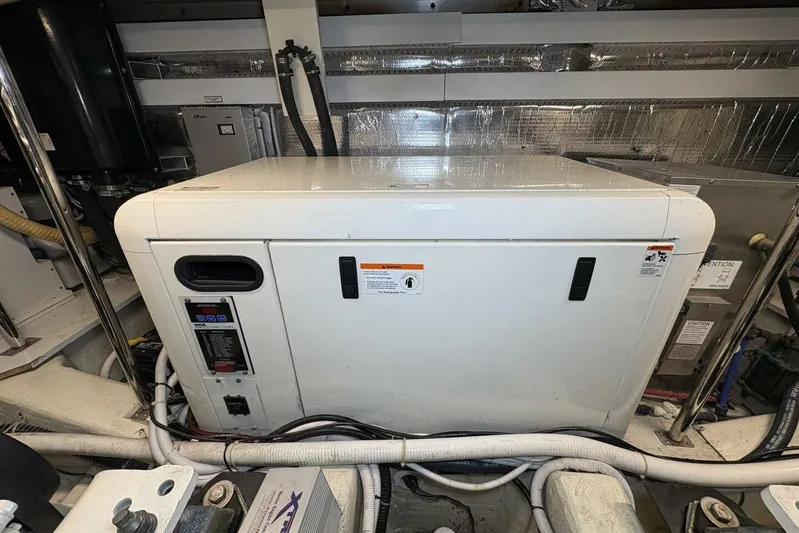 Carlet Vivian IV Yacht Photos Pics Engine room of 2004 Carver 56 Voyager yacht with generator and equipment.