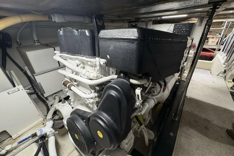 Carlet Vivian IV Yacht Photos Pics Engine room of a 2004 Carver 56 Voyager yacht, showcasing mechanical components.
