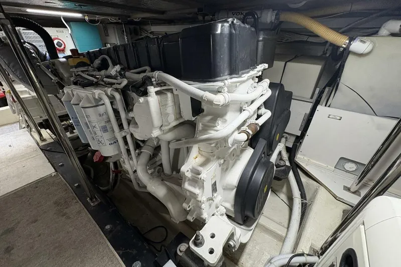 Carlet Vivian IV Yacht Photos Pics Engine room of a 2004 Carver 56 Voyager yacht, showcasing detailed machinery and components.
