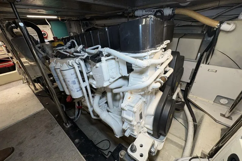 Carlet Vivian IV Yacht Photos Pics Engine room of a 2004 Carver 56 Voyager yacht, showcasing detailed machinery.